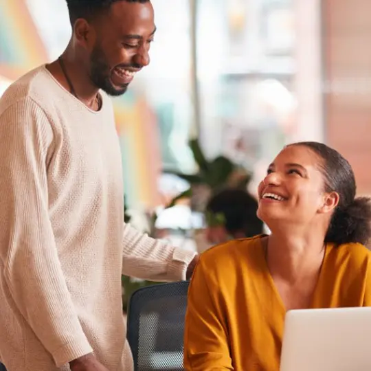 two people collaborating in a modern office