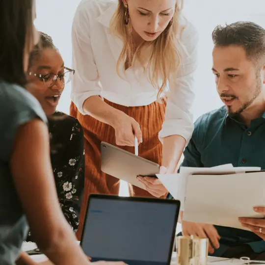 group of four people in a meeting