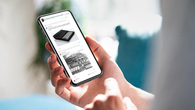 a hand holding a smartphone