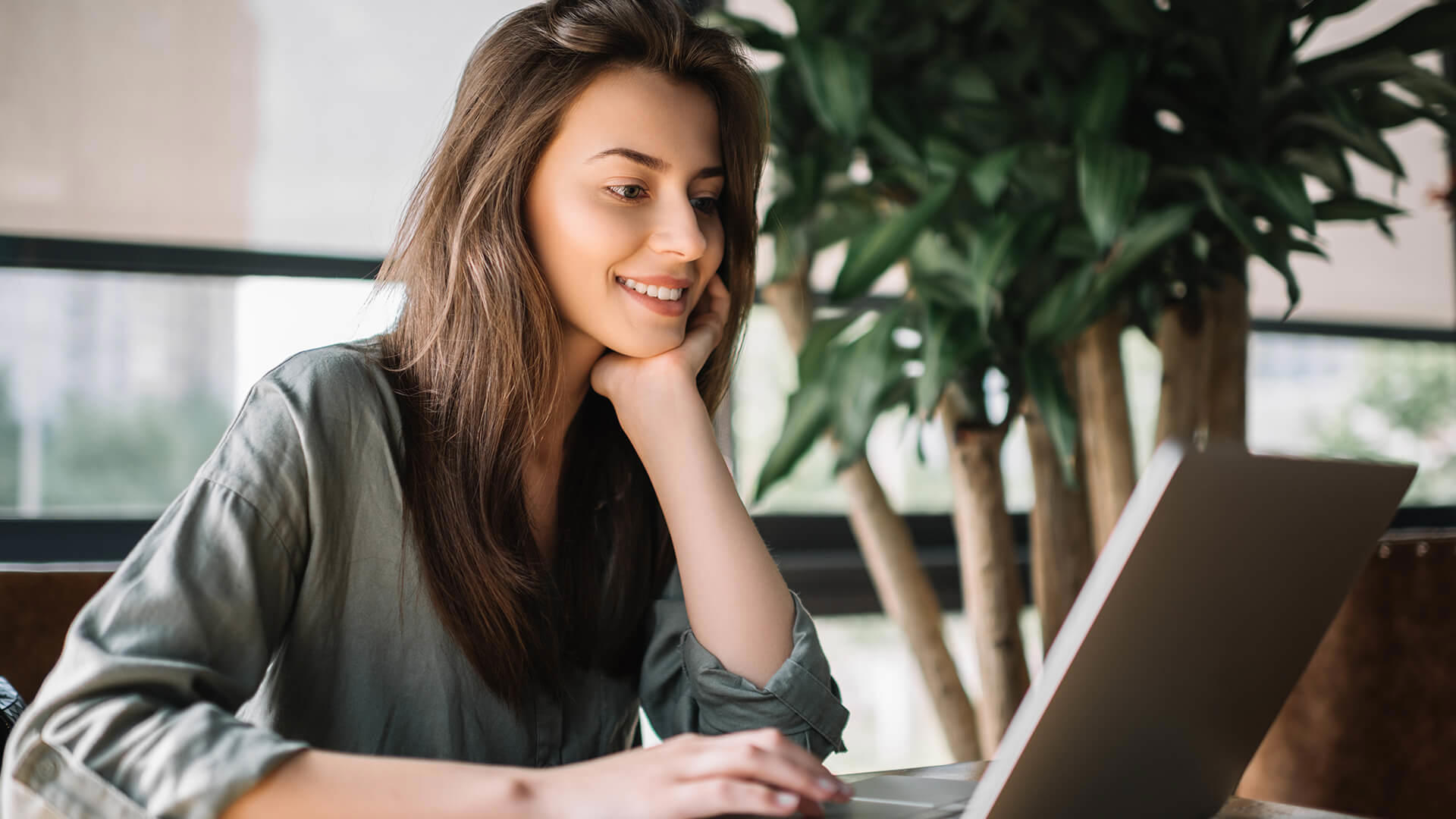 person using laptop at desk