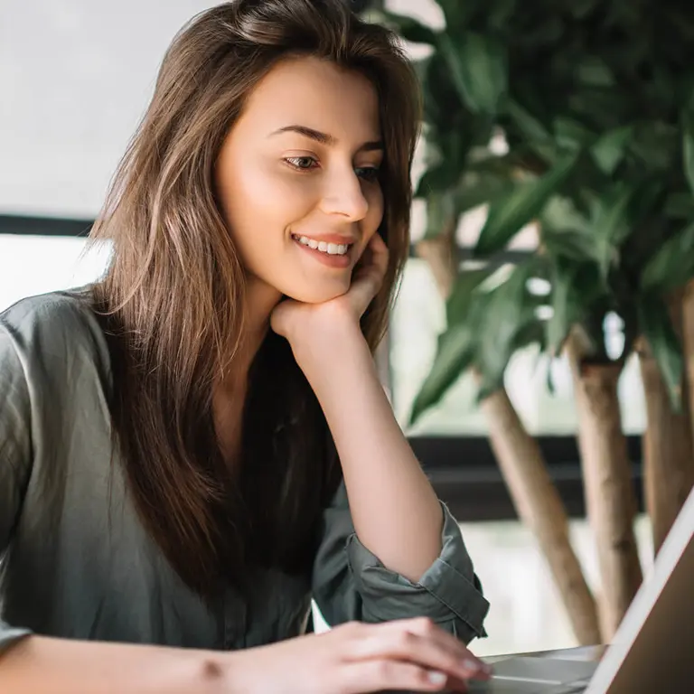 person using laptop at desk
