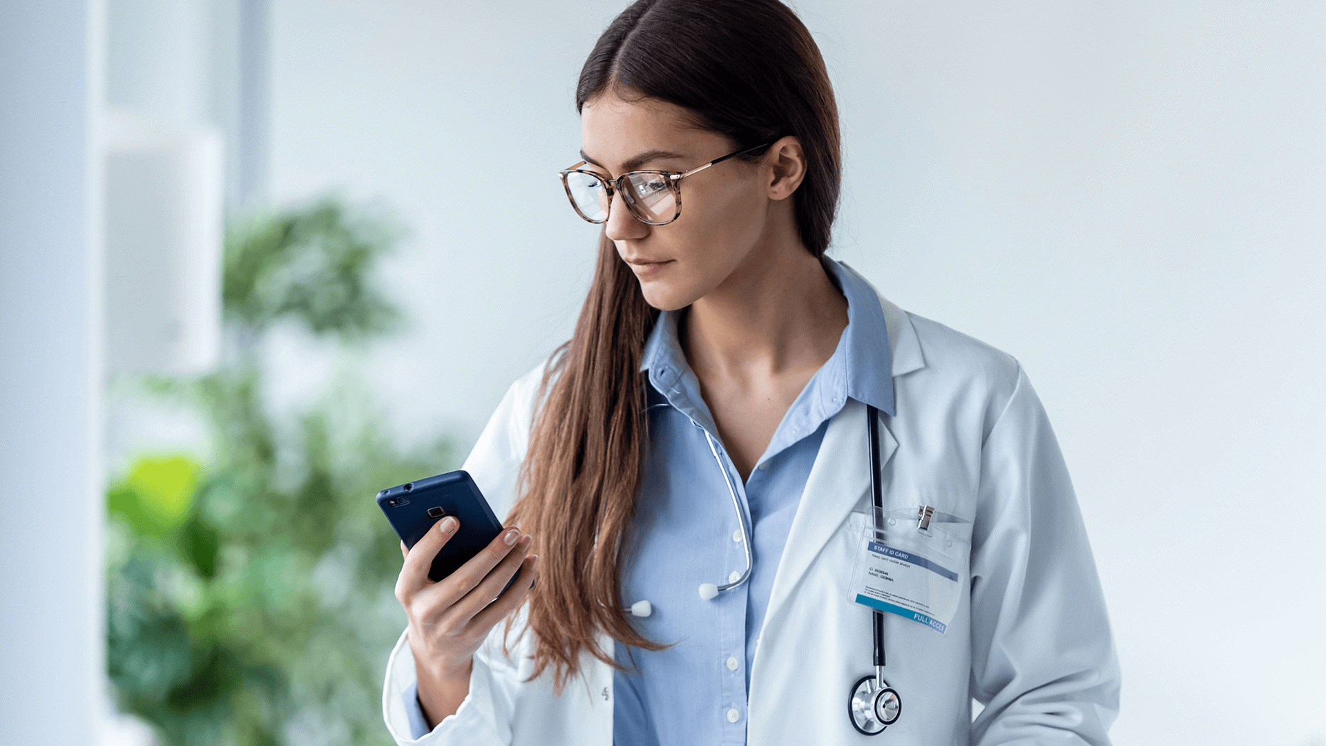 Medical professional reviewing best practices on mobile app