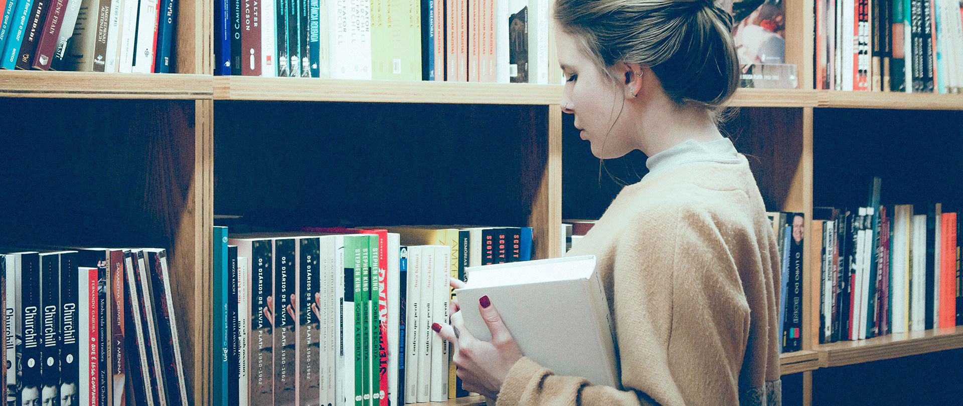 Person browsing bookshelves