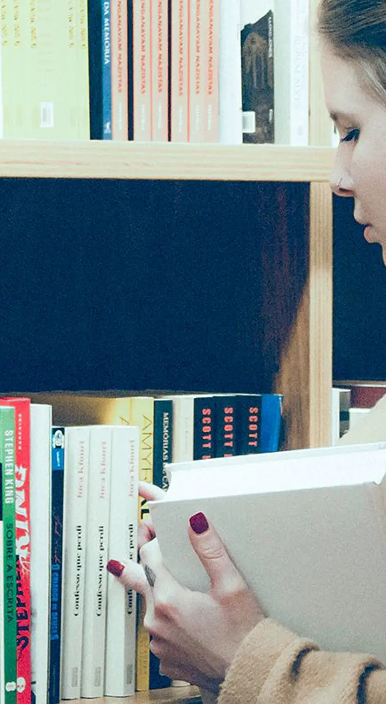 Person browsing bookshelves