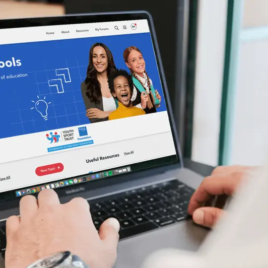 Well schools homepage on a laptop screen